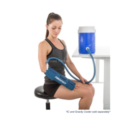 User receiving wrist cold compression therapy using Aircast cryo cuff connected to portable cooling unit for rehabilitation treatment.